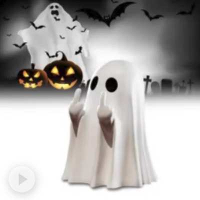 Little ghost statue with jack-o-lanterns