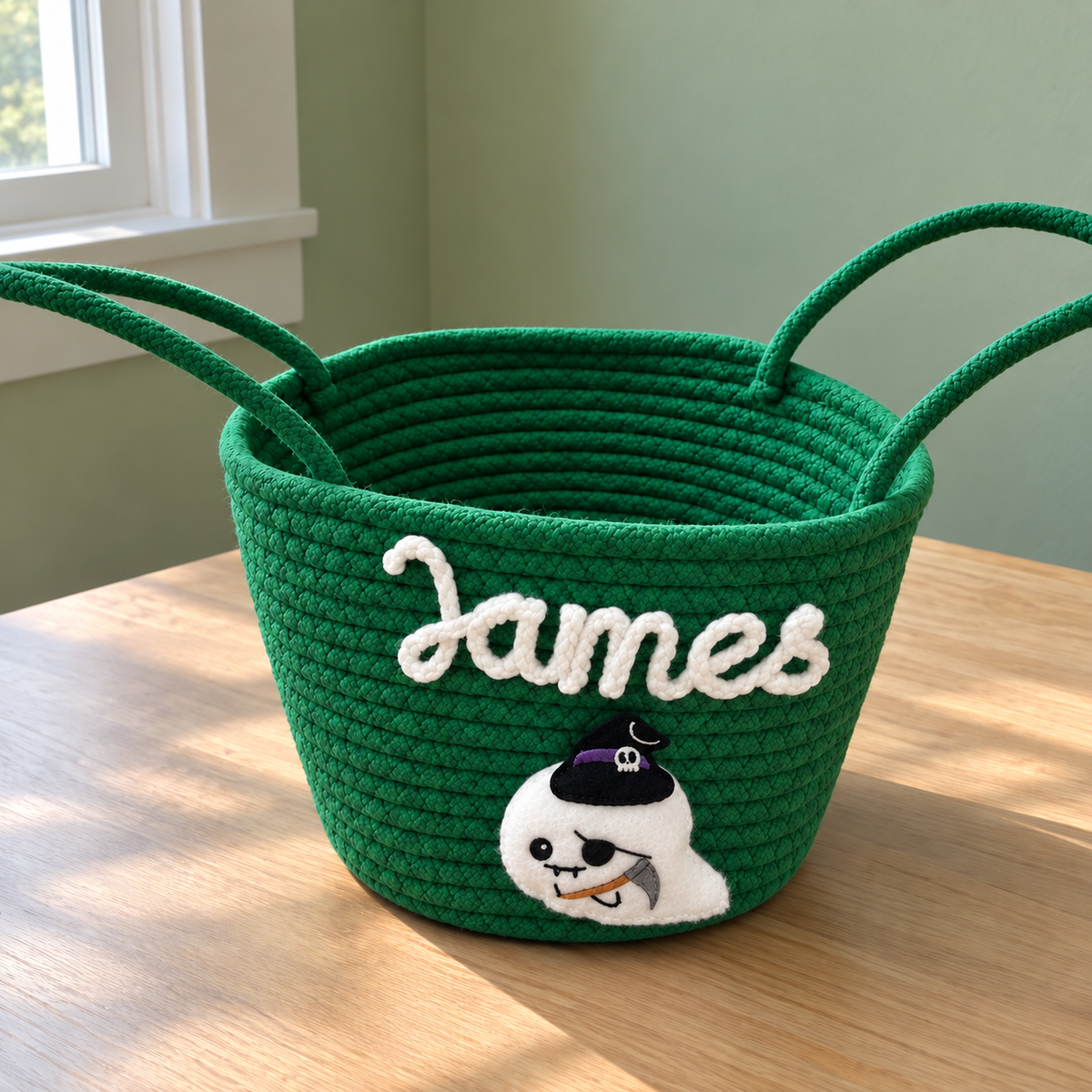 Kelly green personalized Halloween candy basket with the name James and a pirate ghost appliqué