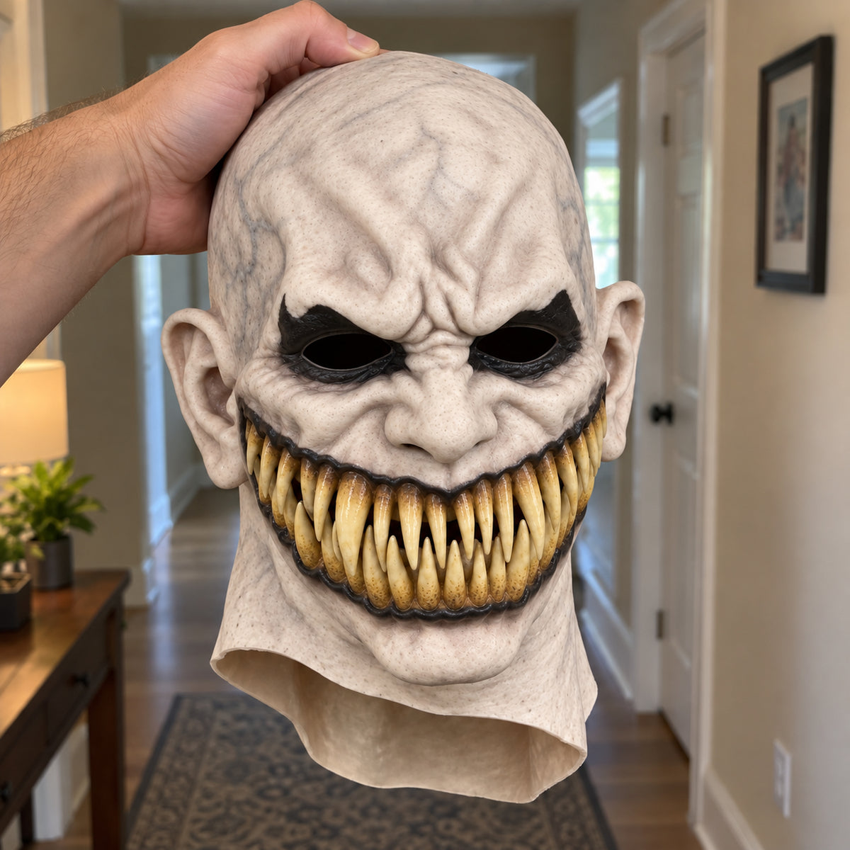 Ghost White latex horror mask with black eyes and yellow fangs – front view