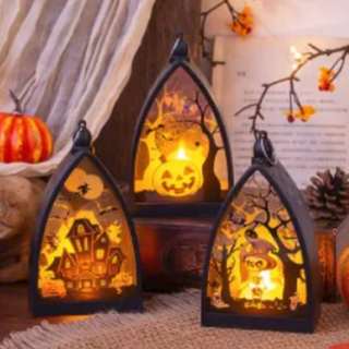 Haunted castle lanterns glowing on a table